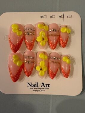 Orange handmade acrylic press on nails with 3D yellow flowers and gold accents